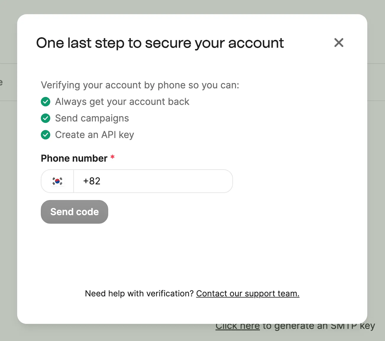 Janela pedindo a verificação do número de telefone para proteger a conta. Aparecem o campo de digitação do número e o botão Send code